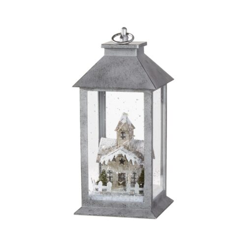 Introducing the enchanting 'Snowflake Soiree' Lantern, a beautifully decorated piece featuring a charming, illuminated winter scene of a church. This elegant lantern is a perfect addition to any Christmas décor, bringing a touch of Christmas magic to your home.