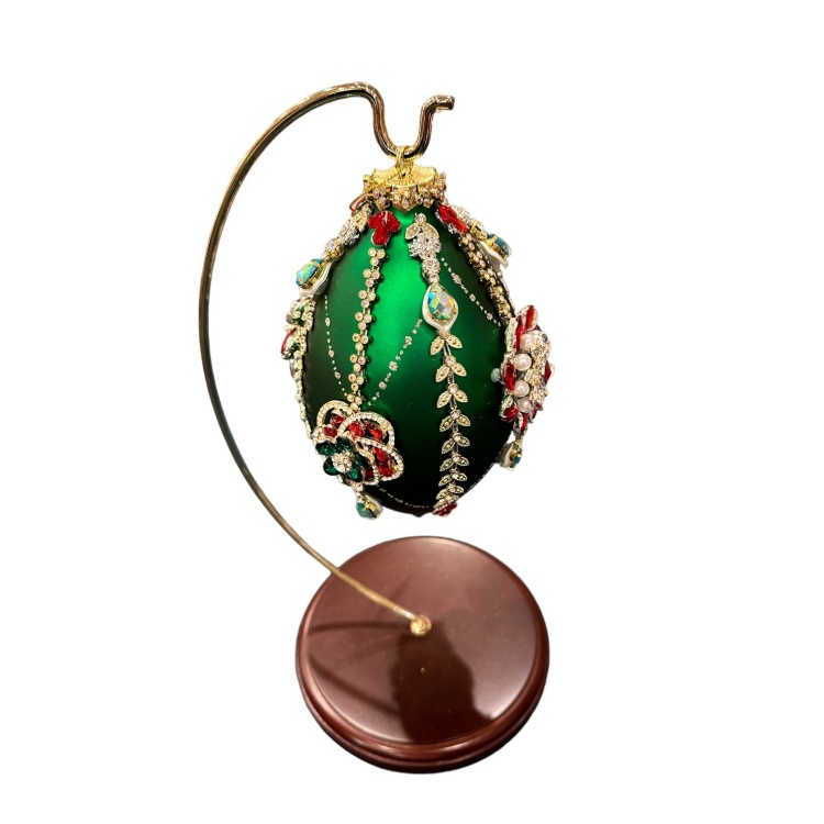 Green Glass Ornament decorated with crystals and jewels, displayed on a Mark Roberts Ornament Stand Sold Separately