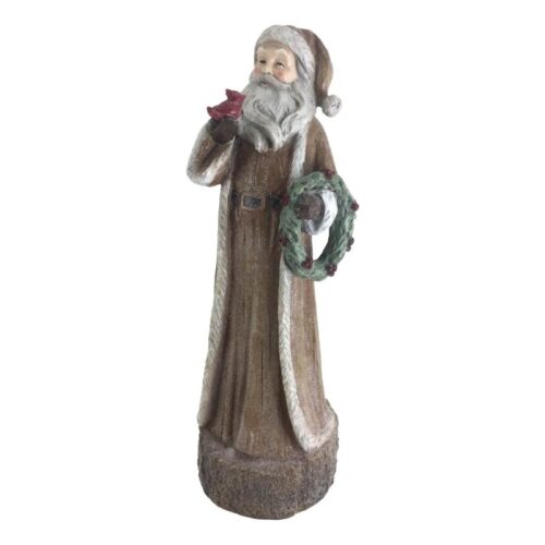 Resin Santa Shelf Decoration, santa is in Natural Colours and is holding a wreath in one hand and a cardinal red bird in the other.